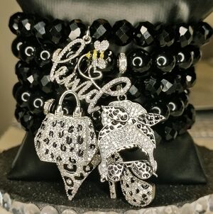 Elegant Black Beaded Bracelet with Silver Charms